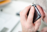Elderly man listening to phone