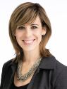 Nancy Marconi, Acting Chief Operating Officer, facing forward and smiling in professional attire.