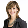 Nancy Marconi, Acting Chief Operating Officer, facing forward and smiling in professional attire.
